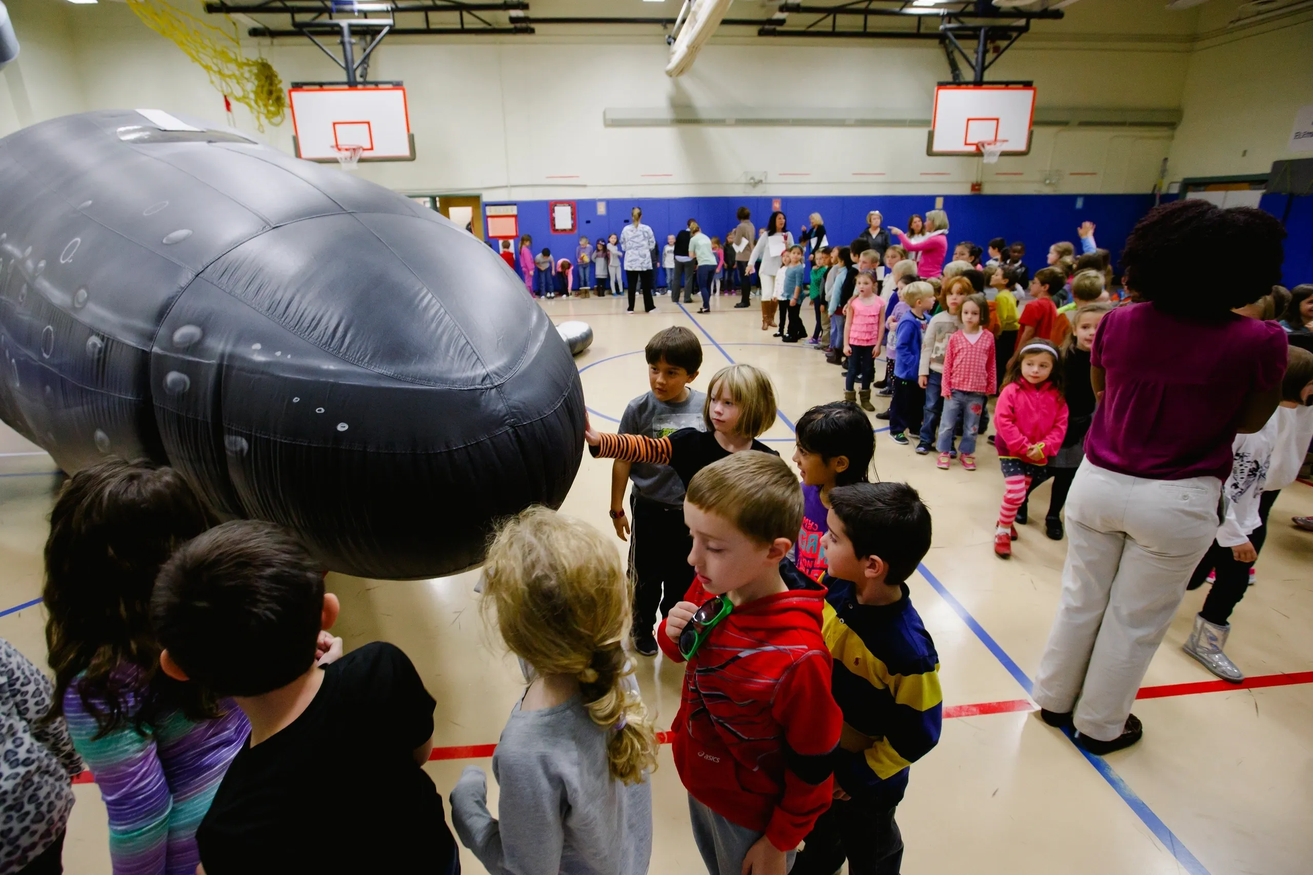 Students exploring the Whale Mobile exhibit